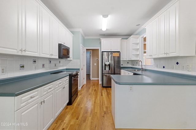 kitchen featuring white cabinets, sink, and black appliances