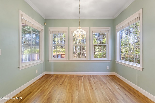 unfurnished sunroom featuring a notable chandelier