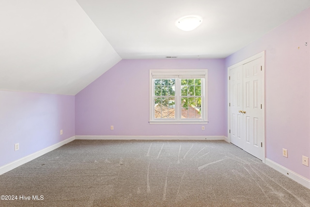 bonus room featuring carpet and lofted ceiling