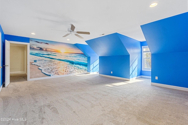 bonus room featuring ceiling fan, light colored carpet, and lofted ceiling