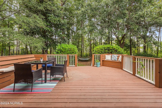 wooden deck featuring outdoor lounge area