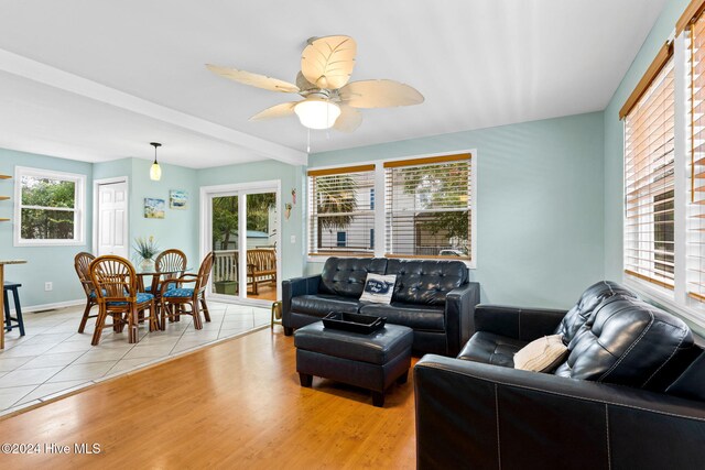 bedroom with ceiling fan, a closet, and hardwood / wood-style floors