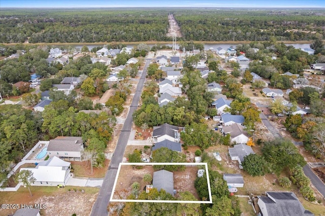 146 NE 5th St, Oak Island, NC 28465 - aerial view featuring a wooded view