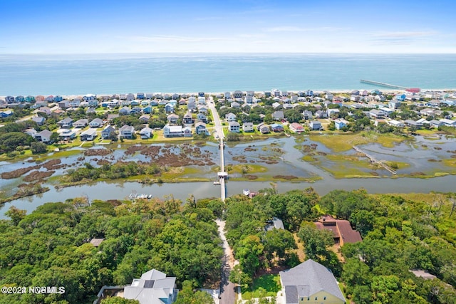 146 NE 5th St, Oak Island, NC 28465 - property view of water featuring a pier and a view of the beach