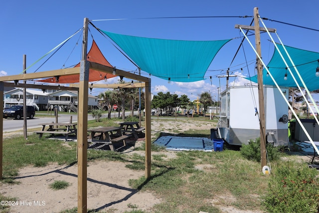 146 NE 5th St, Oak Island, NC 28465 - view of property's community with a lawn and a gazebo
