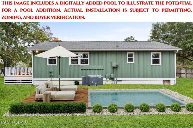 146 NE 5th St, Oak Island, NC 28465 - back of house with a yard, board and batten siding, an outdoor pool, and a shingled roof