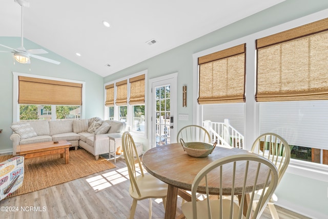 dining area with vaulted ceiling, light hardwood / wood-style flooring, and ceiling fan