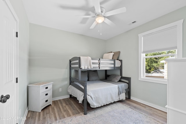 bedroom with ceiling fan and light wood-type flooring