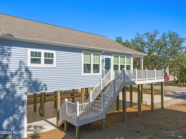 back of property with a patio and a deck