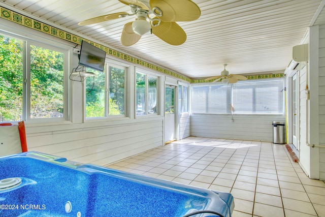 sunroom / solarium featuring a wall mounted air conditioner and ceiling fan