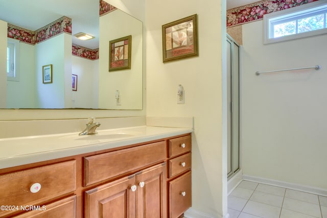 bathroom with vanity, tile patterned floors, and walk in shower