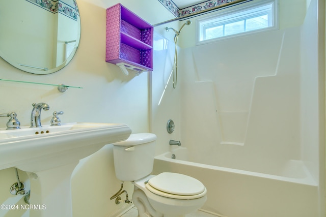 full bathroom featuring sink, toilet, and shower / washtub combination