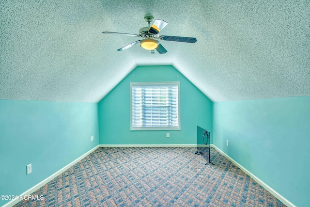 bonus room with ceiling fan, carpet, and lofted ceiling