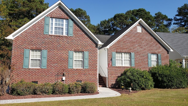 view of side of property with a yard