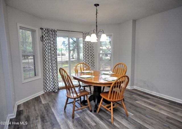 4746 Rail Ct SW, Shallotte, NC 28470 - dining room featuring a chandelier, plenty of natural light, and wood finished floors