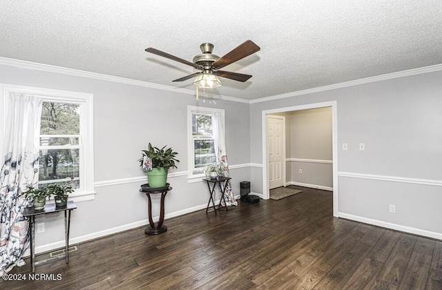 unfurnished room featuring ceiling fan, dark wood-type flooring, crown molding, and a textured ceiling