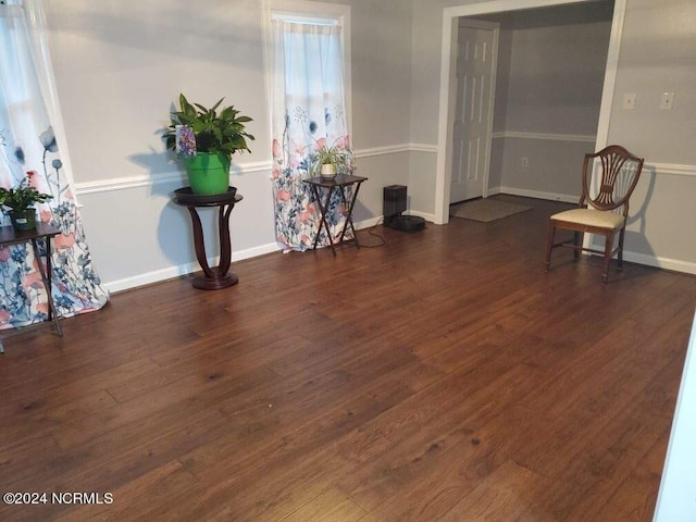 living area with dark hardwood / wood-style flooring