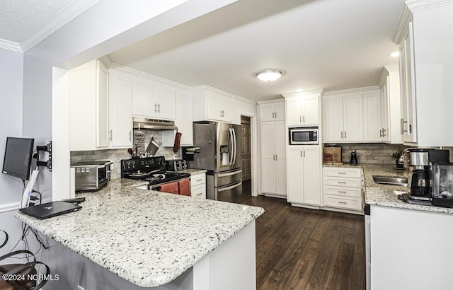 kitchen with kitchen peninsula, light stone counters, stainless steel appliances, and white cabinetry