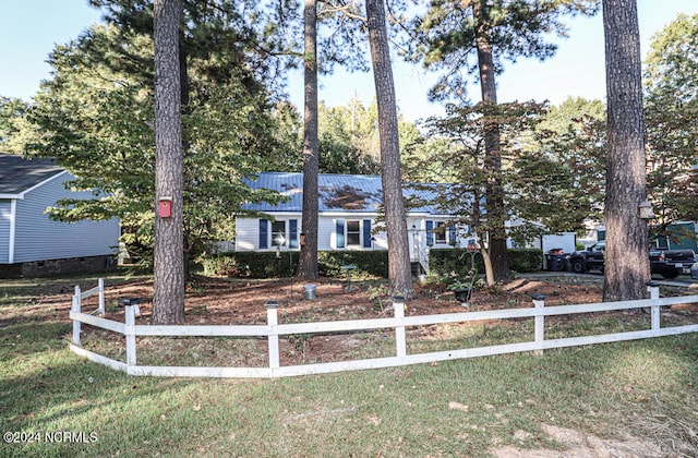 ranch-style home with a front lawn