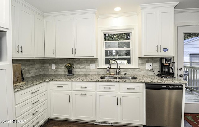 kitchen featuring white cabinetry, dishwasher, light stone counters, and sink