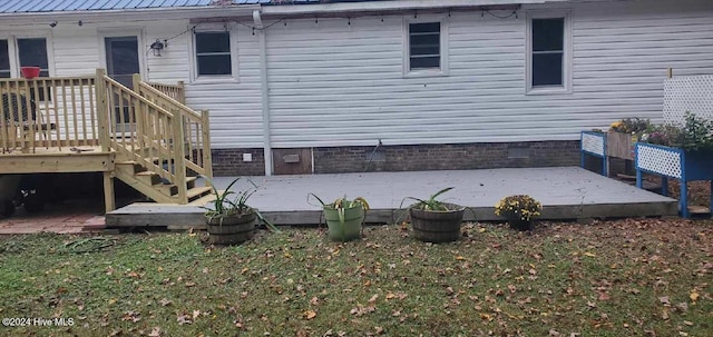 rear view of house featuring a deck