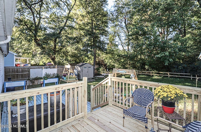 wooden deck with a shed