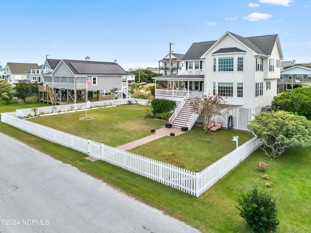 exterior space with a porch and a lawn