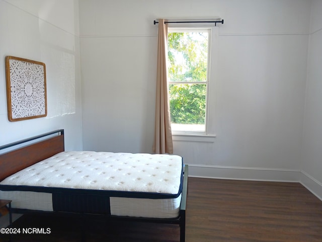 bedroom featuring dark hardwood / wood-style flooring