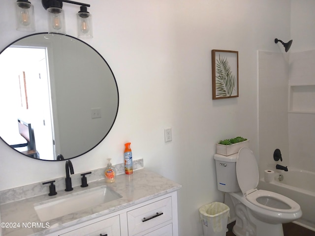 full bathroom with vanity, washtub / shower combination, and toilet