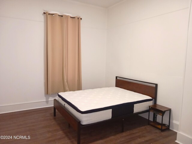 bedroom featuring dark hardwood / wood-style floors