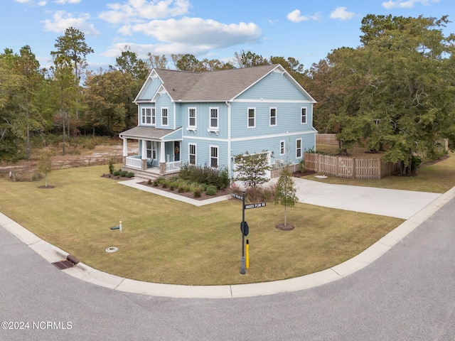 view of front of home with a front lawn and a porch