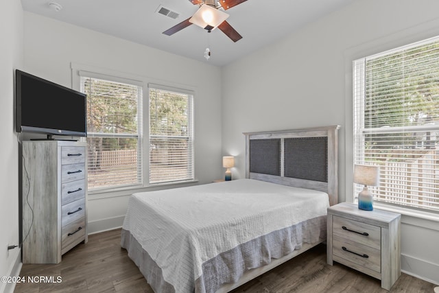 bedroom with ceiling fan and hardwood / wood-style floors