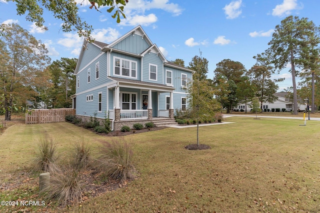 craftsman-style house with a porch and a front yard