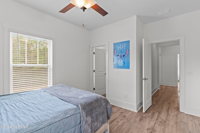 bedroom featuring light wood-type flooring and ceiling fan