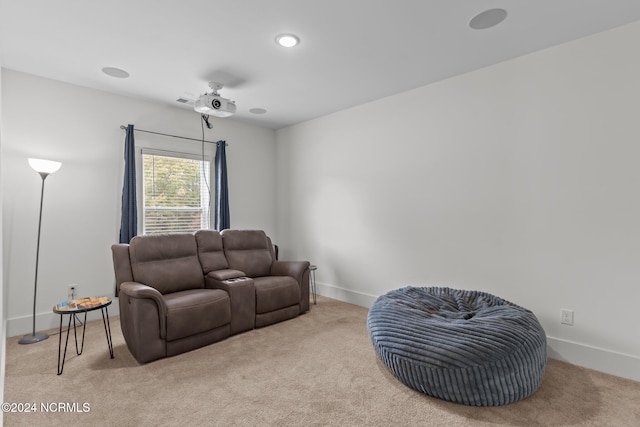 living area with light colored carpet