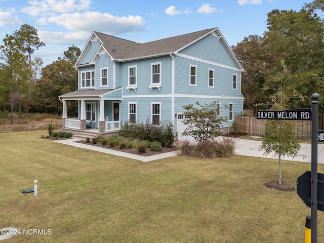 view of front facade with a porch and a front lawn