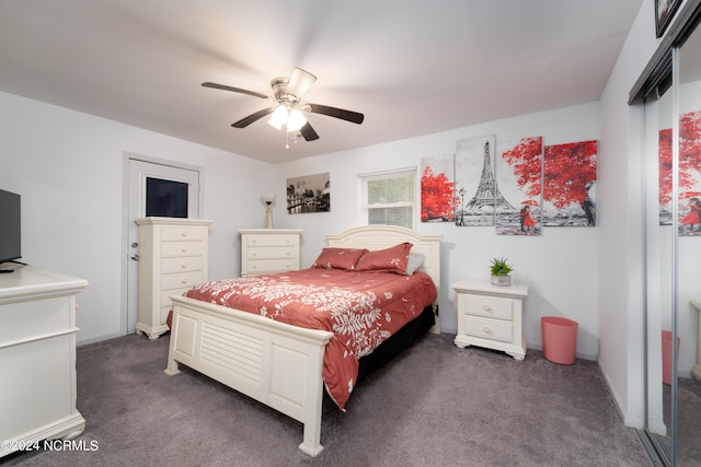 bedroom with dark colored carpet and ceiling fan