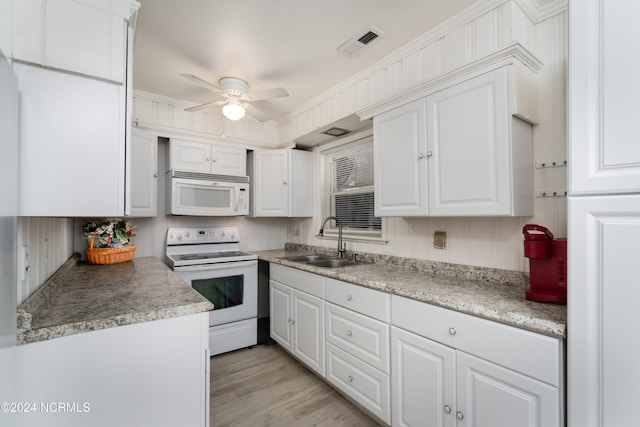 kitchen featuring sink, white cabinetry, light hardwood / wood-style flooring, and white appliances