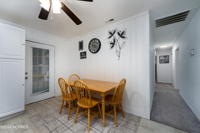 dining area featuring ceiling fan and light wood-type flooring