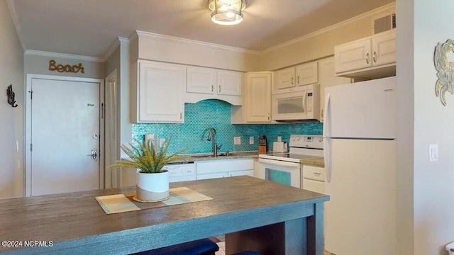 kitchen featuring sink, backsplash, crown molding, white appliances, and white cabinets