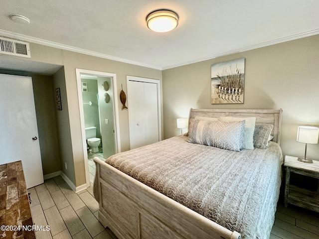 bedroom with ensuite bathroom, ornamental molding, and light hardwood / wood-style flooring