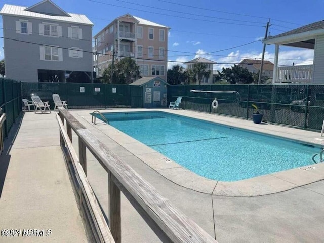 view of pool featuring a patio