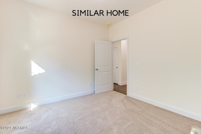 empty room featuring carpet flooring