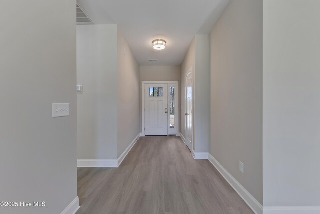 hallway with dark hardwood / wood-style floors