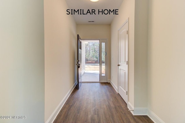 corridor featuring dark hardwood / wood-style floors