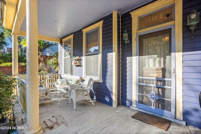 wooden terrace with a porch