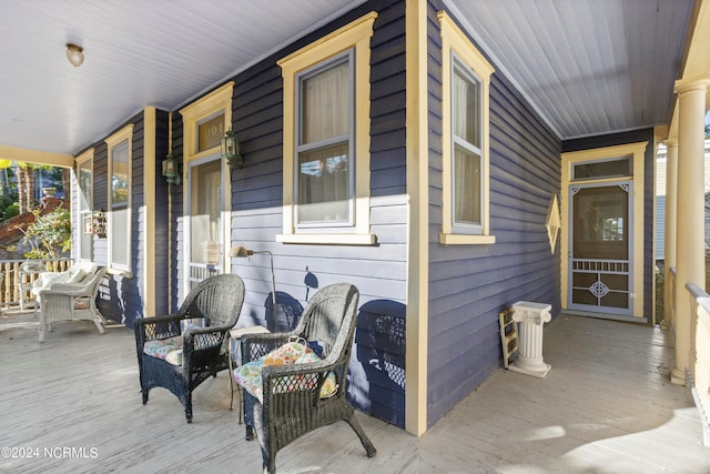 wooden terrace with a porch