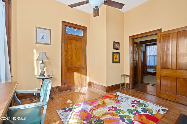 entryway with light hardwood / wood-style floors and ceiling fan