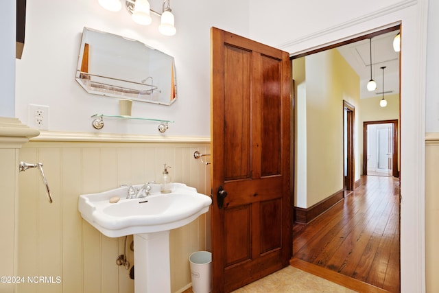 bathroom with hardwood / wood-style flooring