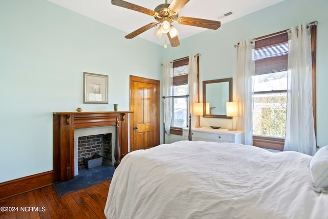 bedroom with a closet, ceiling fan, and dark hardwood / wood-style flooring